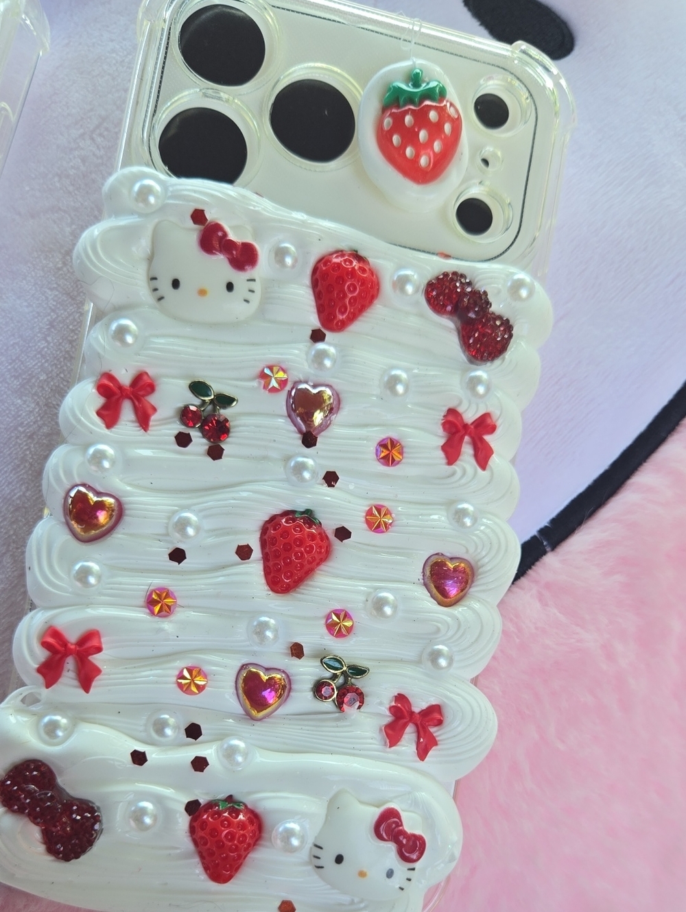 Hello Kitty White IPhone 17 Case with Red Strawberry & Bow Accents